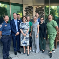 Mary-Anne Thomas, Cameron Goodyear with staff members from Austin Health and Ambulance Victoria.